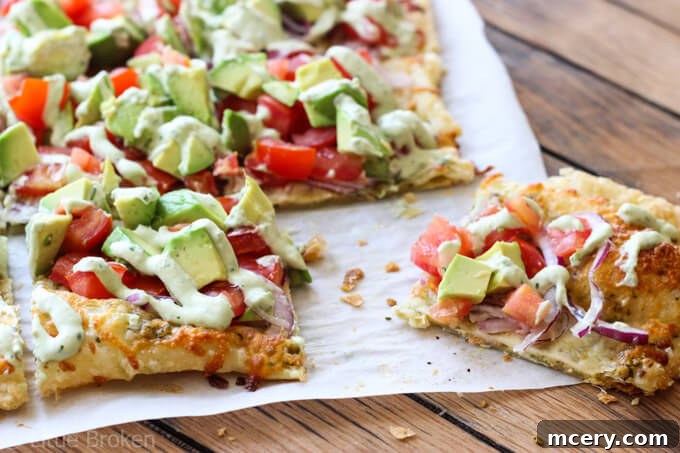 The Green Goddess Pizza 5 Whole avocado pizza sliced into squares, ready to serve