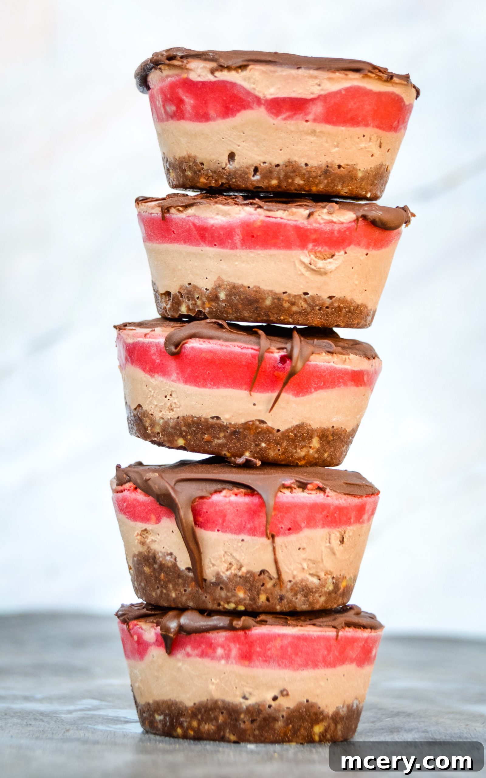 Beautifully arranged No-Bake Vegan Chocolate Raspberry Cakes with a fork, ready to be served