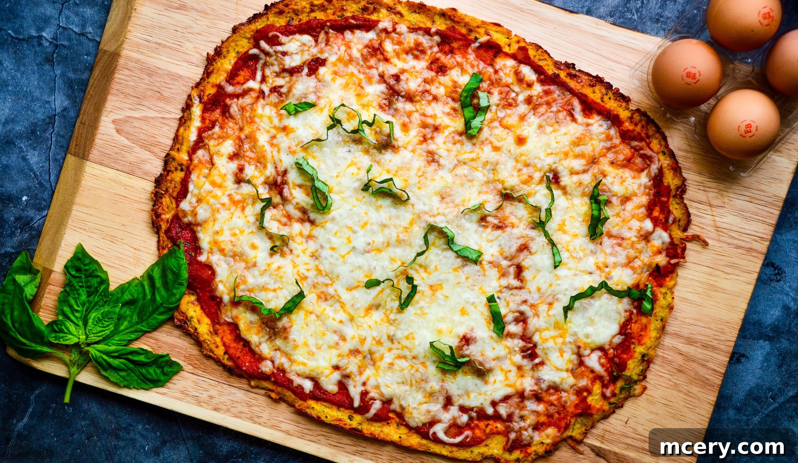 The Ultimate Cauliflower Pizza Base 3 Close-up of a golden-brown cauliflower pizza crust, showing its crisp texture.