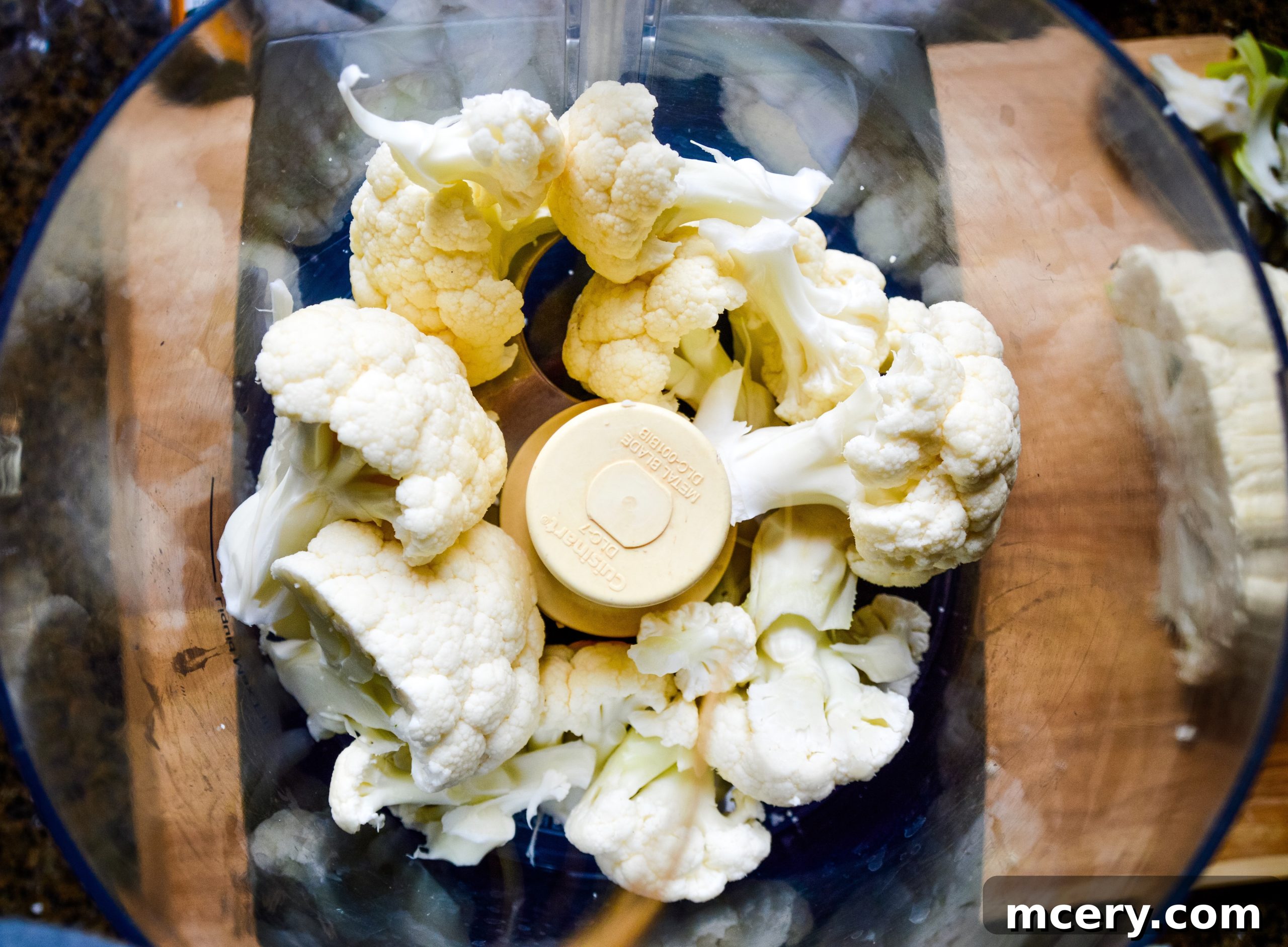 The Ultimate Cauliflower Pizza Base 6 Finely riced cauliflower in a food processor.