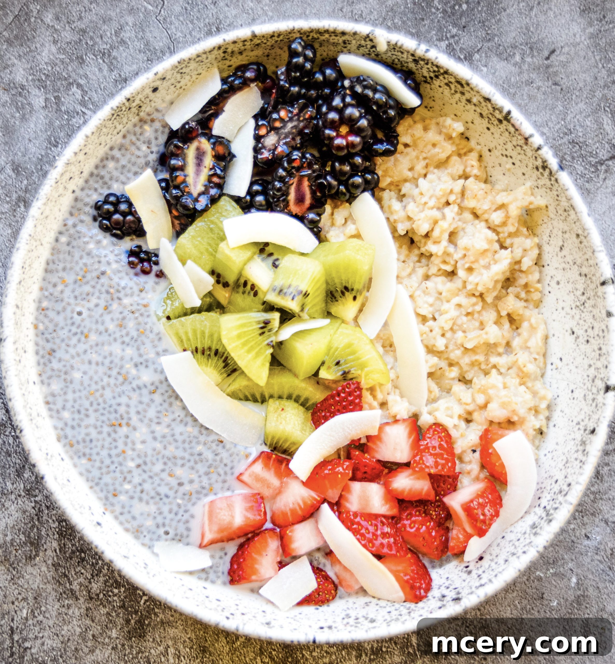 Wholesome Chia Oat Power Bowl 2 A beautifully arranged Chia Pudding and Oats Breakfast Bowl, garnished with fresh fruits like berries and kiwi slices.