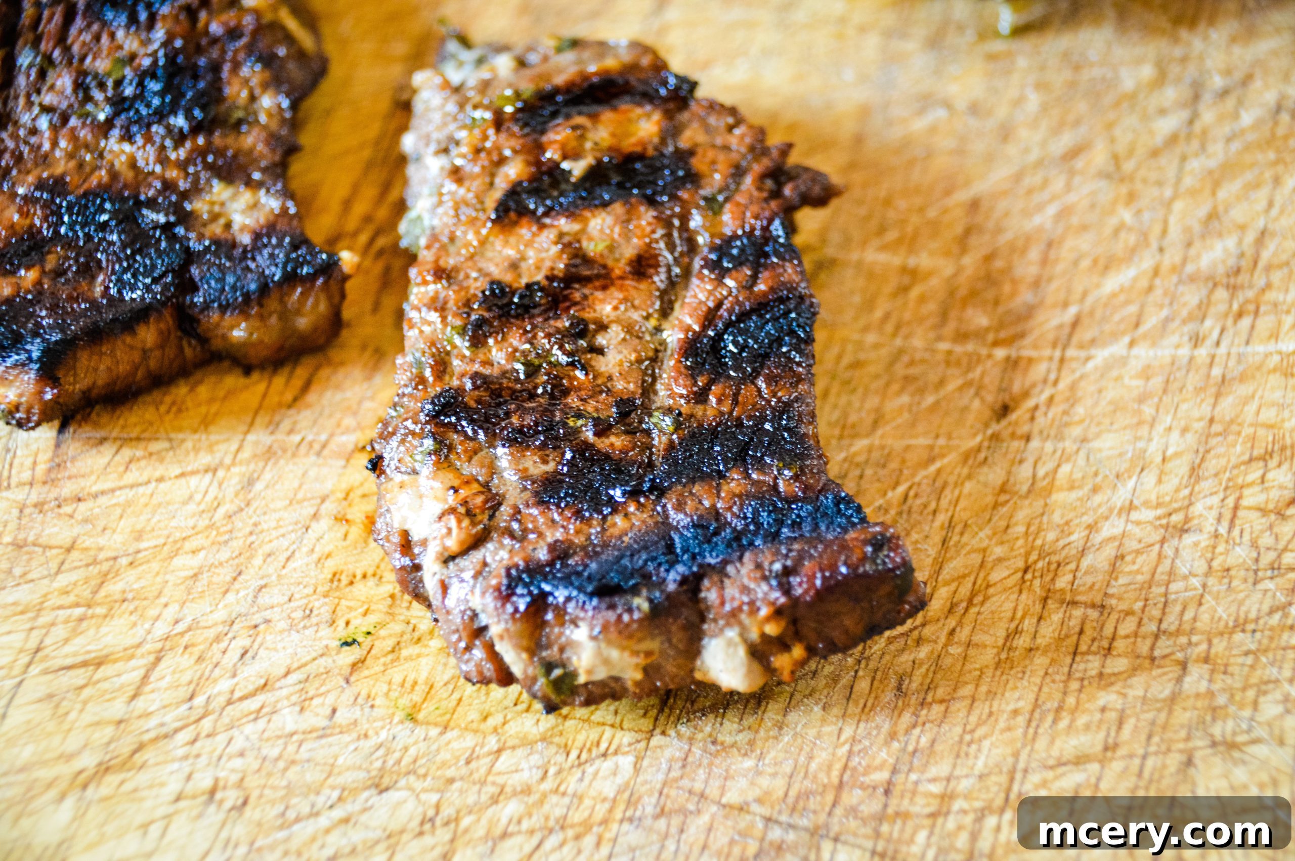 Elevate Your Steak The Ultimate Marinade Secret 6 Perfectly cooked steak, sliced and resting on a cutting board, showing its juicy interior