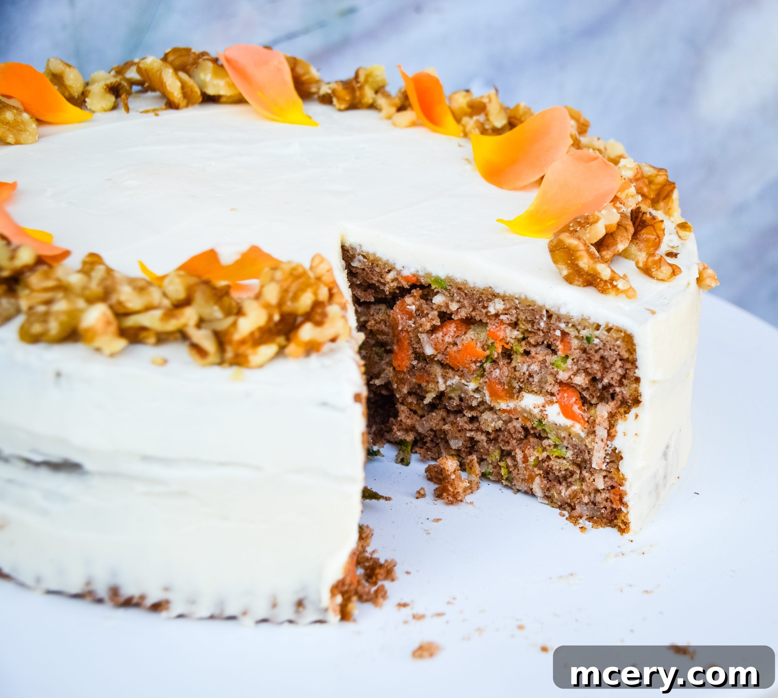 Wholesome Carrot and Zucchini Cake 4 A beautifully frosted Healthy Carrot & Zucchini Cake on a wire rack, ready to be served.