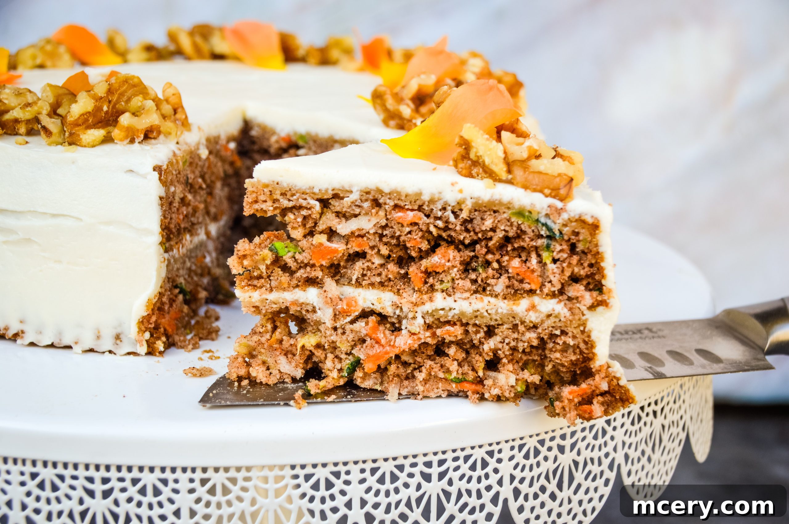 Wholesome Carrot and Zucchini Cake 5 A top-down view of the whole Healthy Carrot & Zucchini Cake, garnished with walnuts, ready to be sliced.