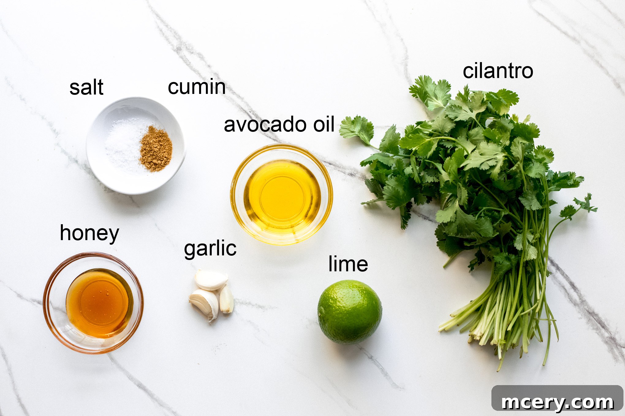 Bright Cilantro Lime Dressing 3 Ingredients for cilantro lime vinaigrette laid out on a table