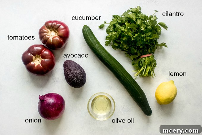Heirloom Tomato Harvest Salad 4 All fresh ingredients for making heirloom tomato salad laid out on a kitchen counter