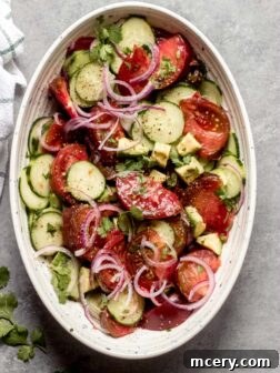 Heirloom tomato salad in a serving bowl, ready to be enjoyed