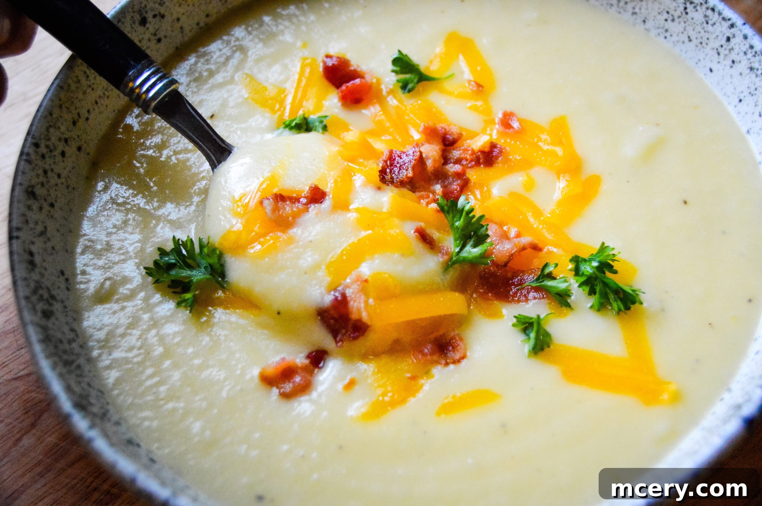 Instant Pot Velvety Cauliflower Cheese Soup 3 A close-up of the rich, golden cauliflower cheese soup, showcasing its smooth texture and potential for delightful toppings.
