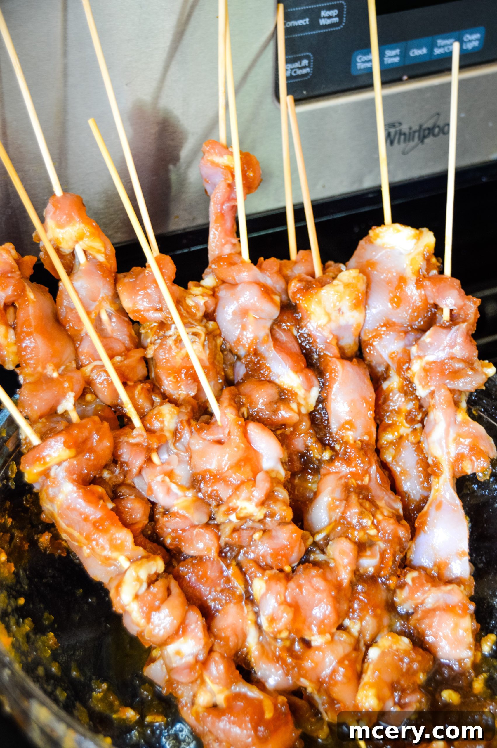 Sticky Teriyaki Chicken Skewers 6 Close-up of Teriyaki Chicken Skewers being cooked on a grill or cast iron, showing delicious char marks.