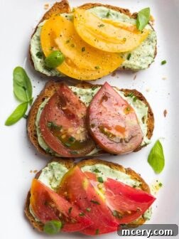 Crisp toast topped with garlic-herb mayonnaise and sweet juicy heirloom tomato slices. Breakfast, lunch, or dinner at its finest