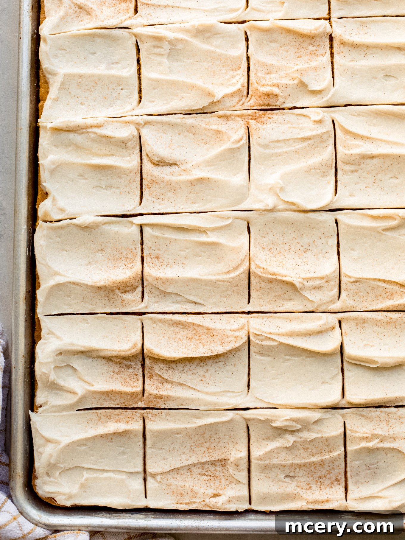 Spiced Pumpkin Sheet Cake 2 Delicious pumpkin sheet cake with cream cheese frosting, perfect for fall and holidays.