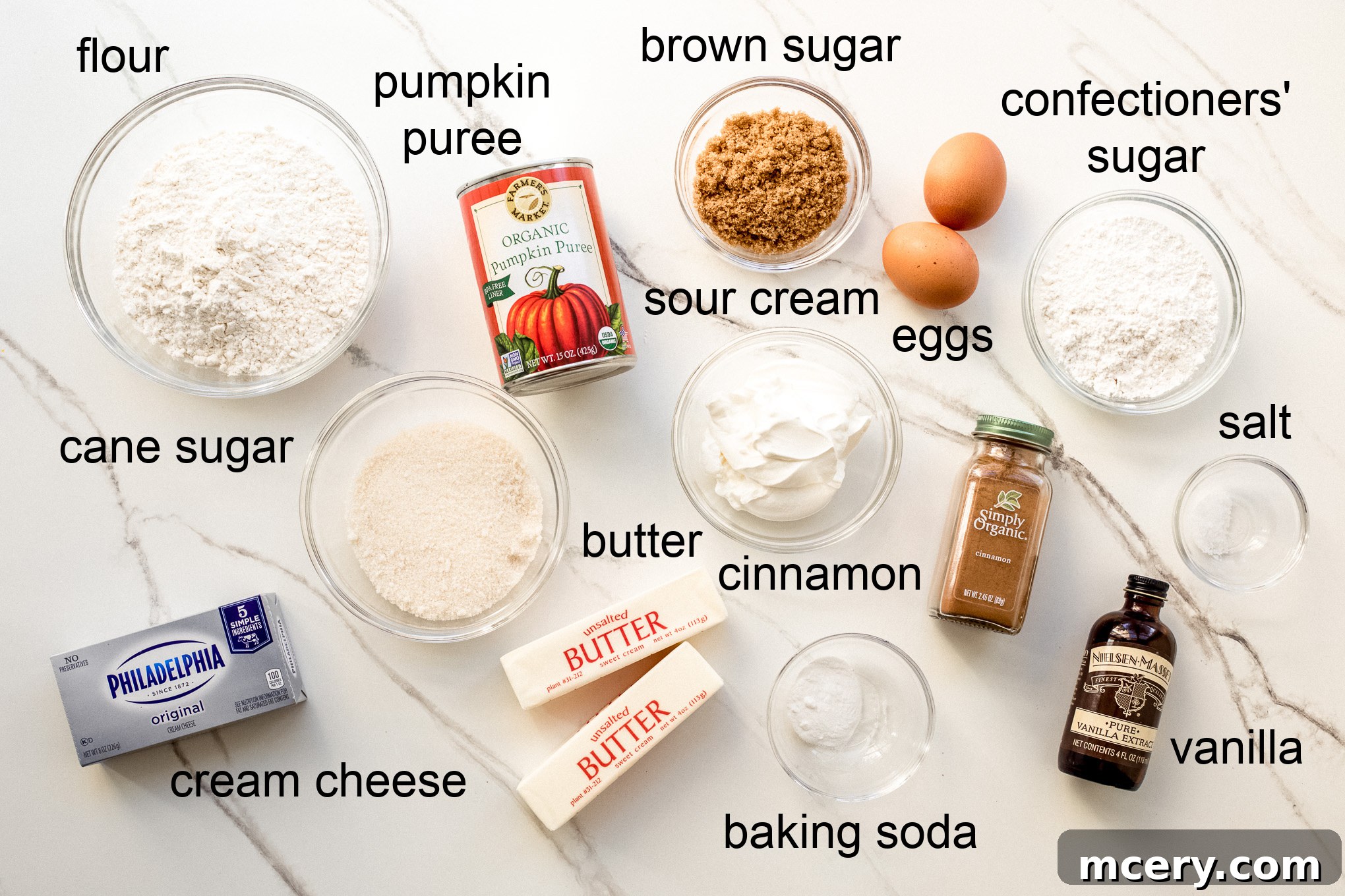 Spiced Pumpkin Sheet Cake 3 Ingredients laid out for pumpkin sheet cake recipe including flour, sugar, pumpkin puree, and butter.