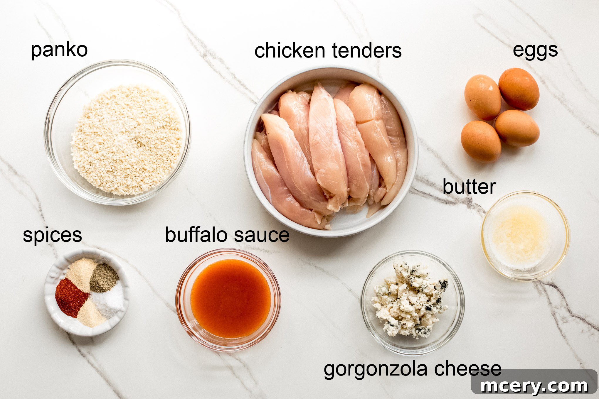 Ingredients for homemade buffalo chicken tenders laid out.