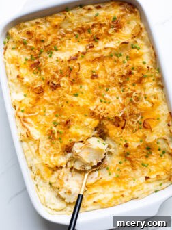 cheesy mashed potatoes in a serving bowl