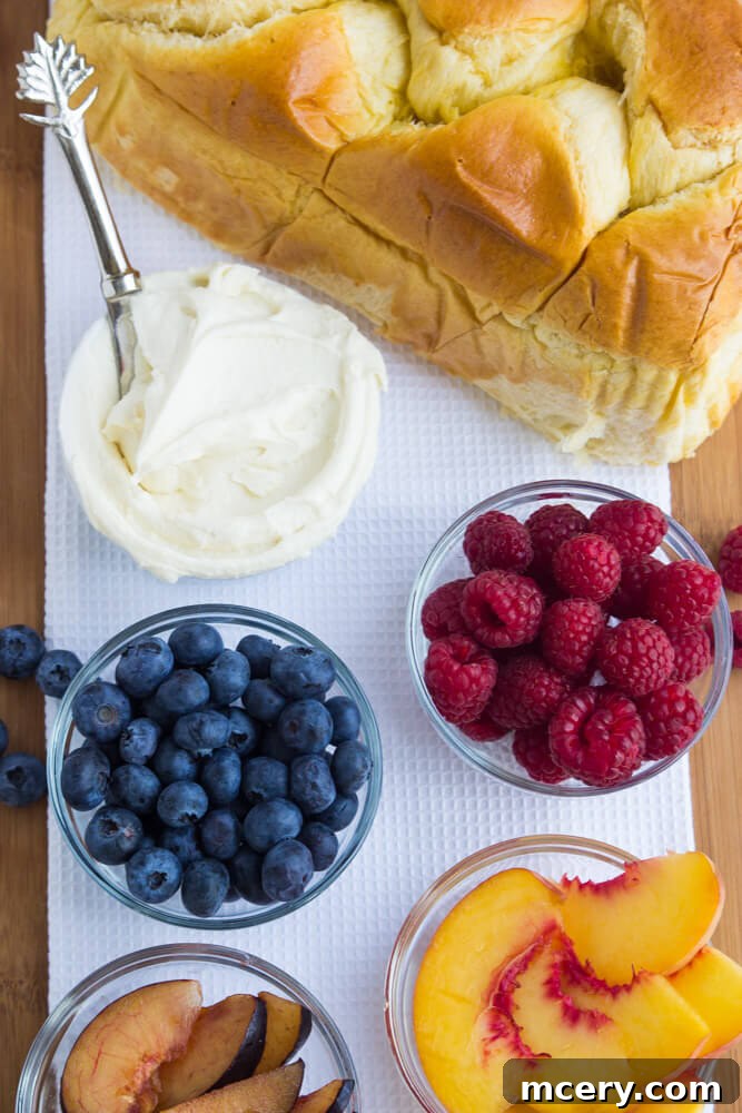 Artisan Fruit Toast 3 Bowls filled with a variety of fresh berries, including raspberries, blueberries, and blackberries, ready to be used as toppings for fruit toast.