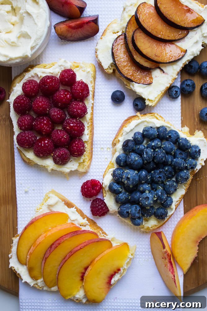 Artisan Fruit Toast 5 A beautifully prepared fruit toast topped with an array of fresh berries and a glistening drizzle of honey, ready to be served.
