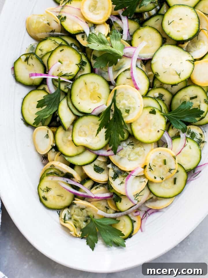Marinated raw squash salad with zucchini, red onions, and fresh herbs
