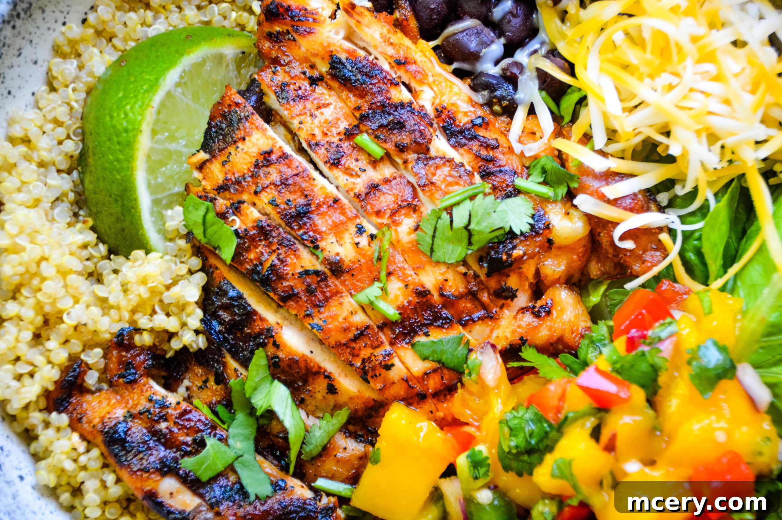 Chopped Orange Chipotle Chicken served in tacos with fresh toppings.