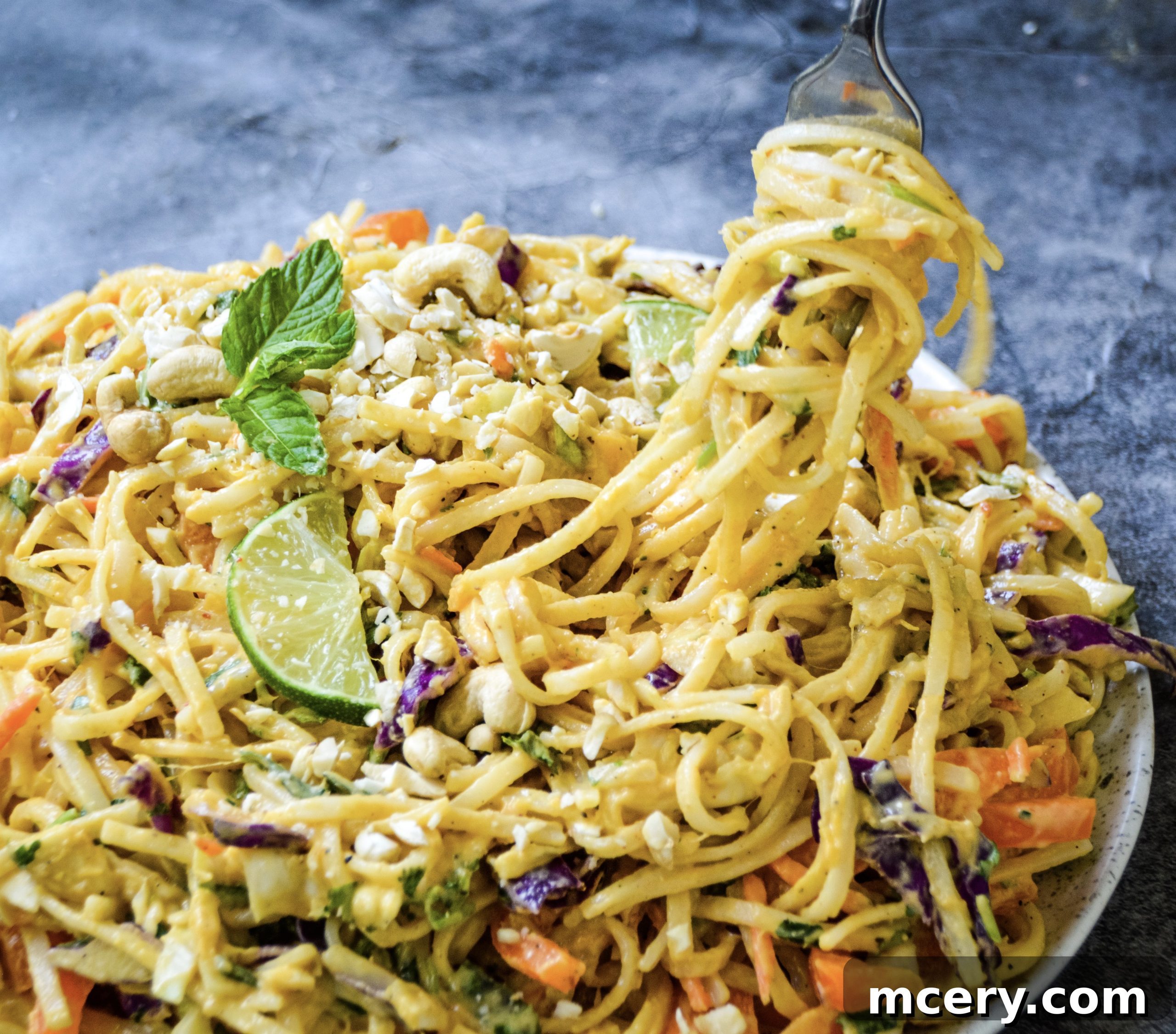 Delicious Thai Noodle Salad Ready to Serve A beautifully plated bowl of Thai Noodle Salad with Peanut Sauce, garnished with fresh cilantro and crushed peanuts, ready to be served.
