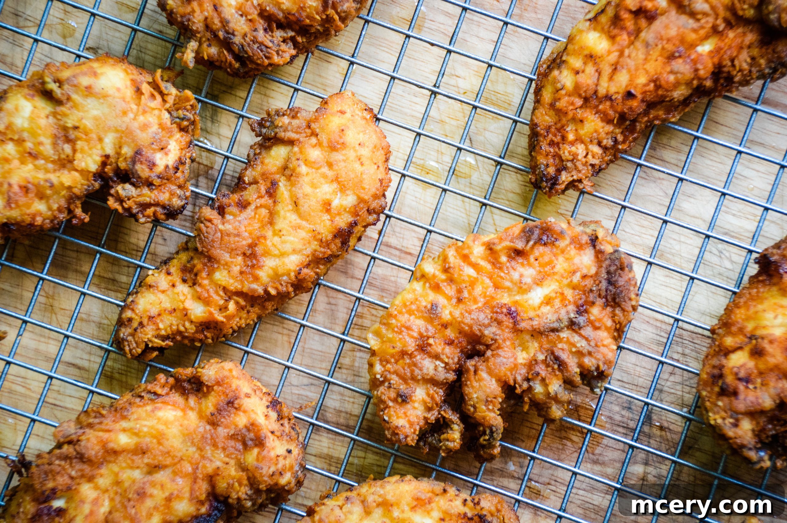 Golden Crunchy Chicken Strips 4 Close-up of crispy chicken tenders cooking in a cast iron skillet.