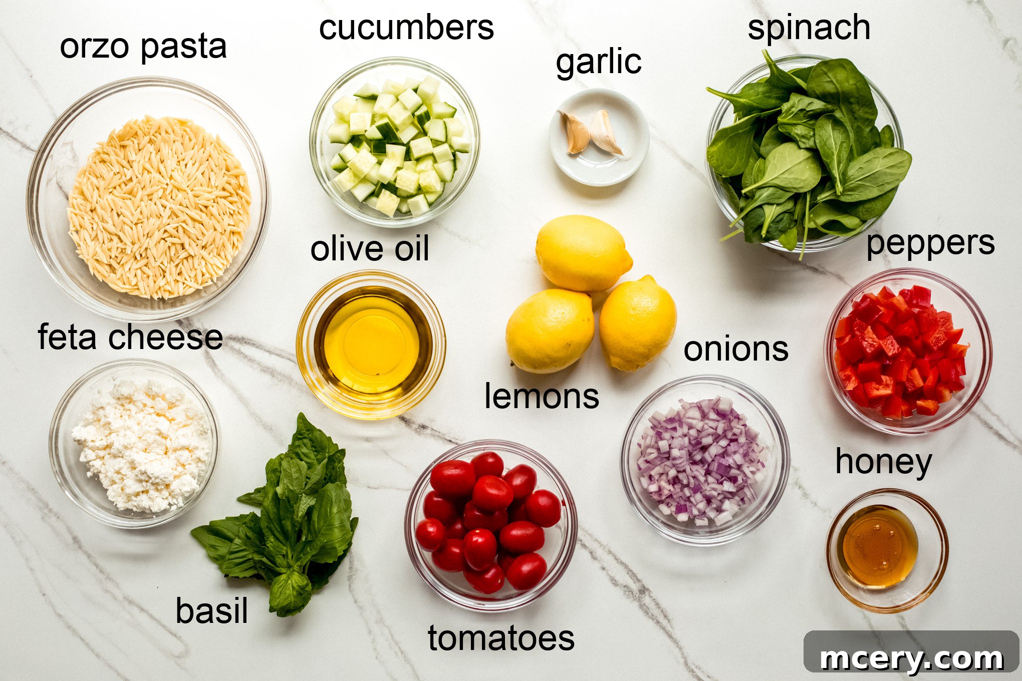Bright Lemon Orzo Salad 3 A visual spread of ingredients for lemon orzo pasta salad, neatly arranged.