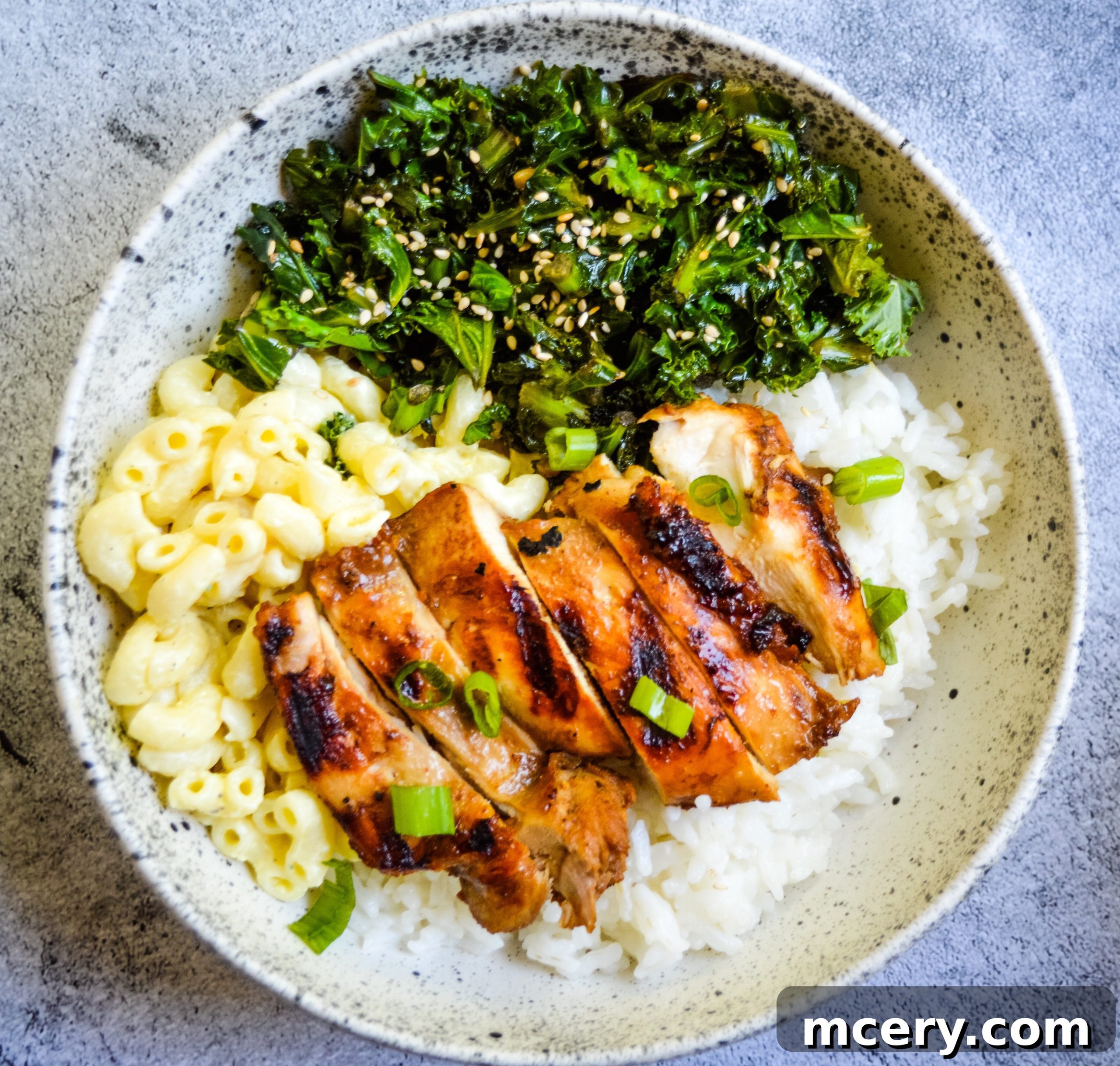 Close-up of marinated chicken pieces, ready for grilling, showcasing their rich color from the teriyaki sauce.