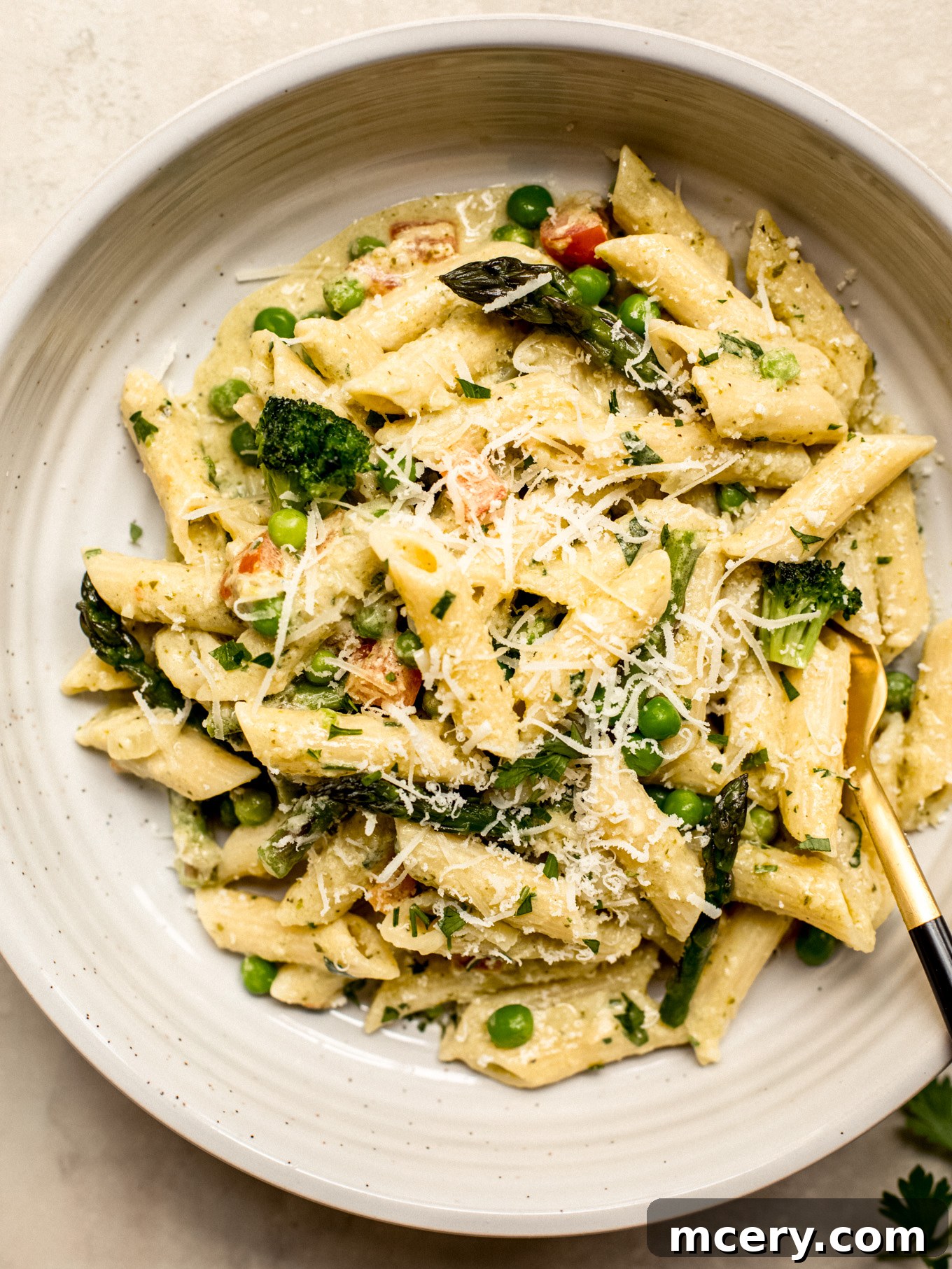 A beautifully plated bowl of Penne Primavera, showcasing its creamy sauce, colorful vegetables, and tender pasta, ready to be enjoyed.