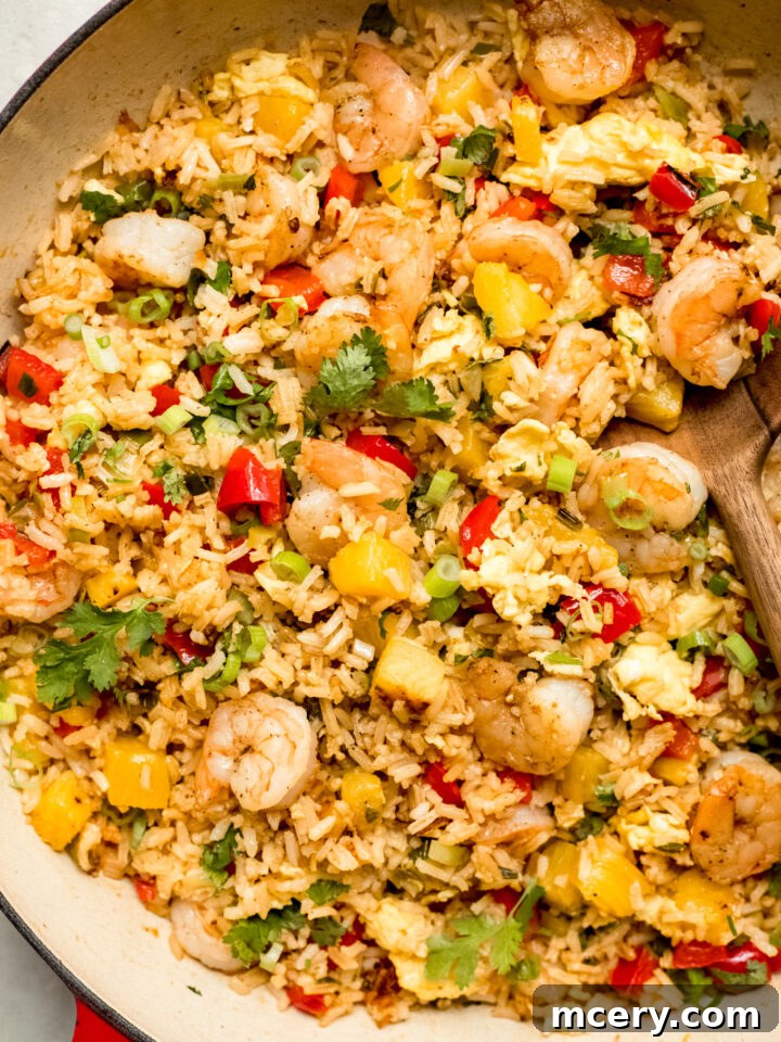 close up fried rice with shrimp in a skillet.