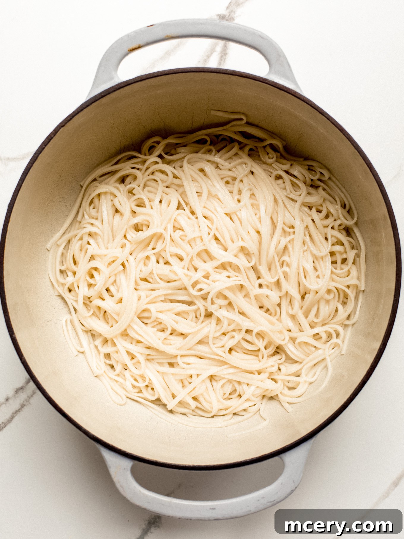Irresistible Creamy Cajun Sausage Pasta 5 drained pasta in a pot.