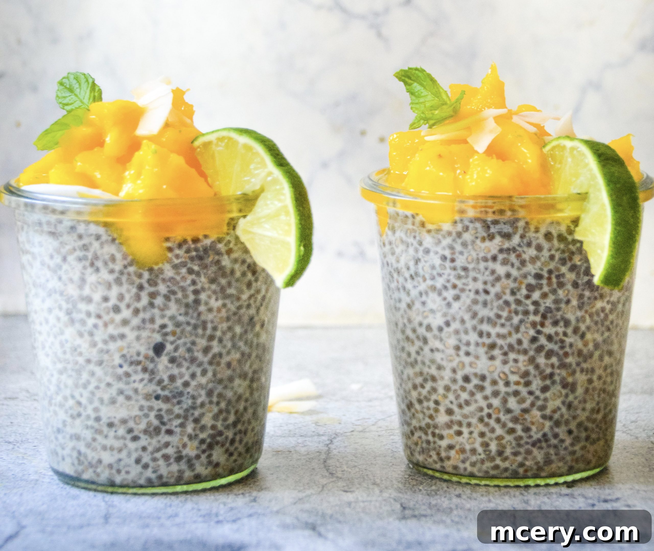 Sunshine Mango Lime Chia Pudding 2 Beautifully presented Mango Lime Chia Pudding in a glass jar, garnished with fresh mango slices and a hint of lime.
