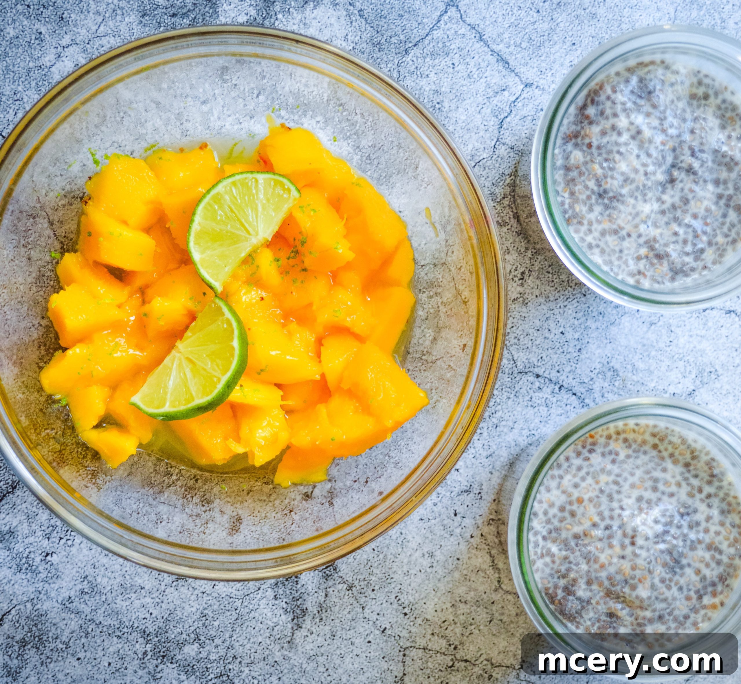 Sunshine Mango Lime Chia Pudding 6 A spoon scooping creamy Mango Lime Chia Pudding from a glass, highlighting the layers.