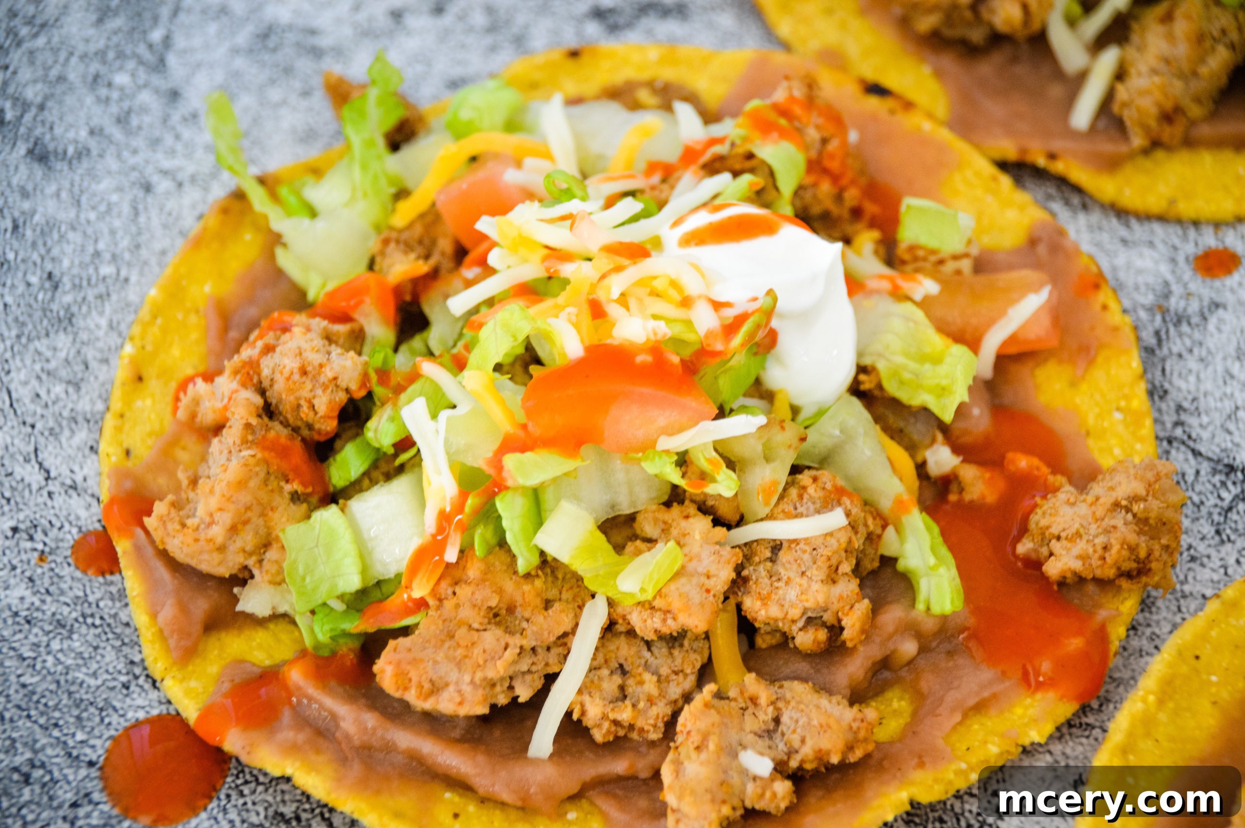 Crispy Tostadas in 15 Minutes 5 Warm refried beans spread on a tostada shell