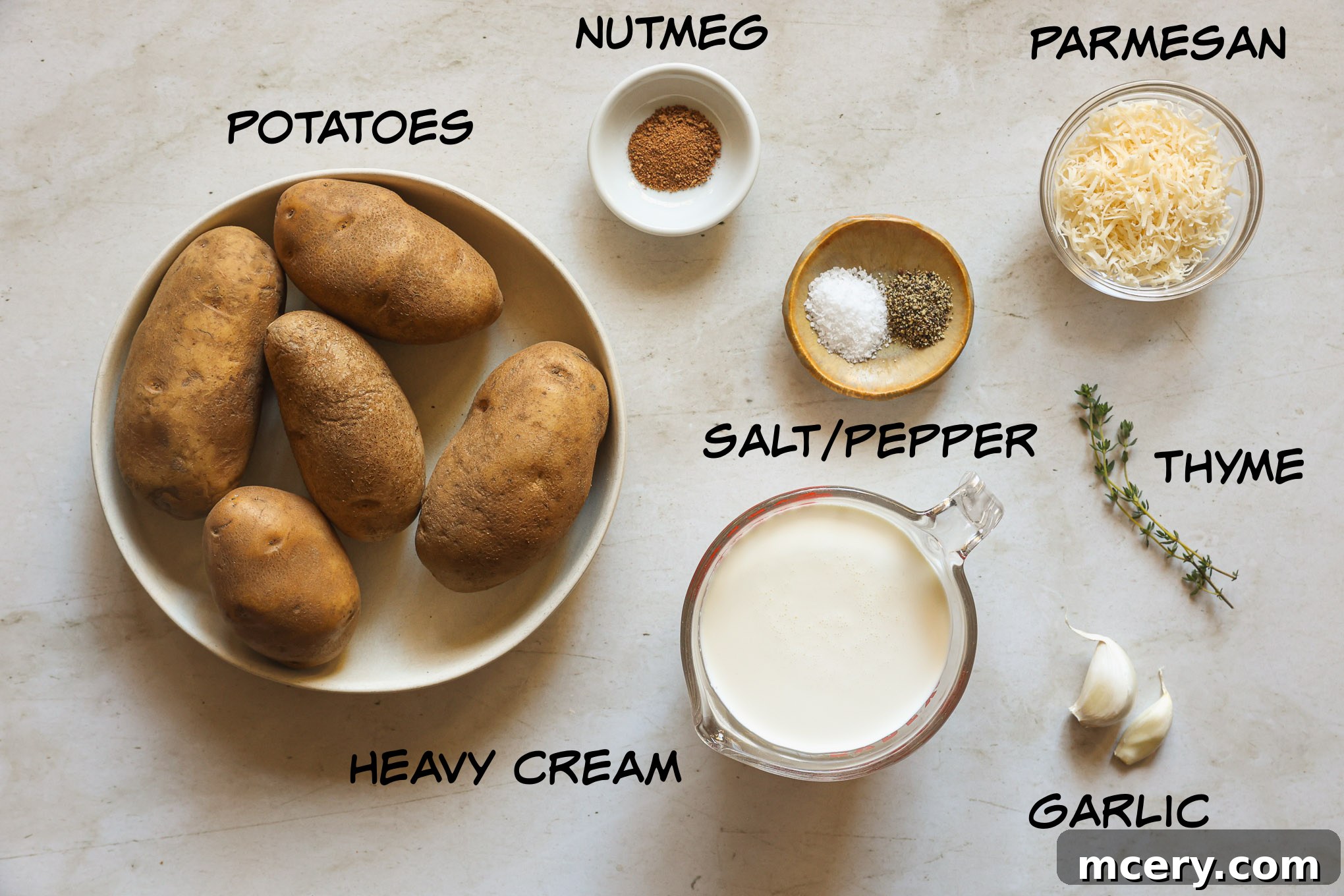 A collection of fresh ingredients laid out for making muffin tin potatoes.