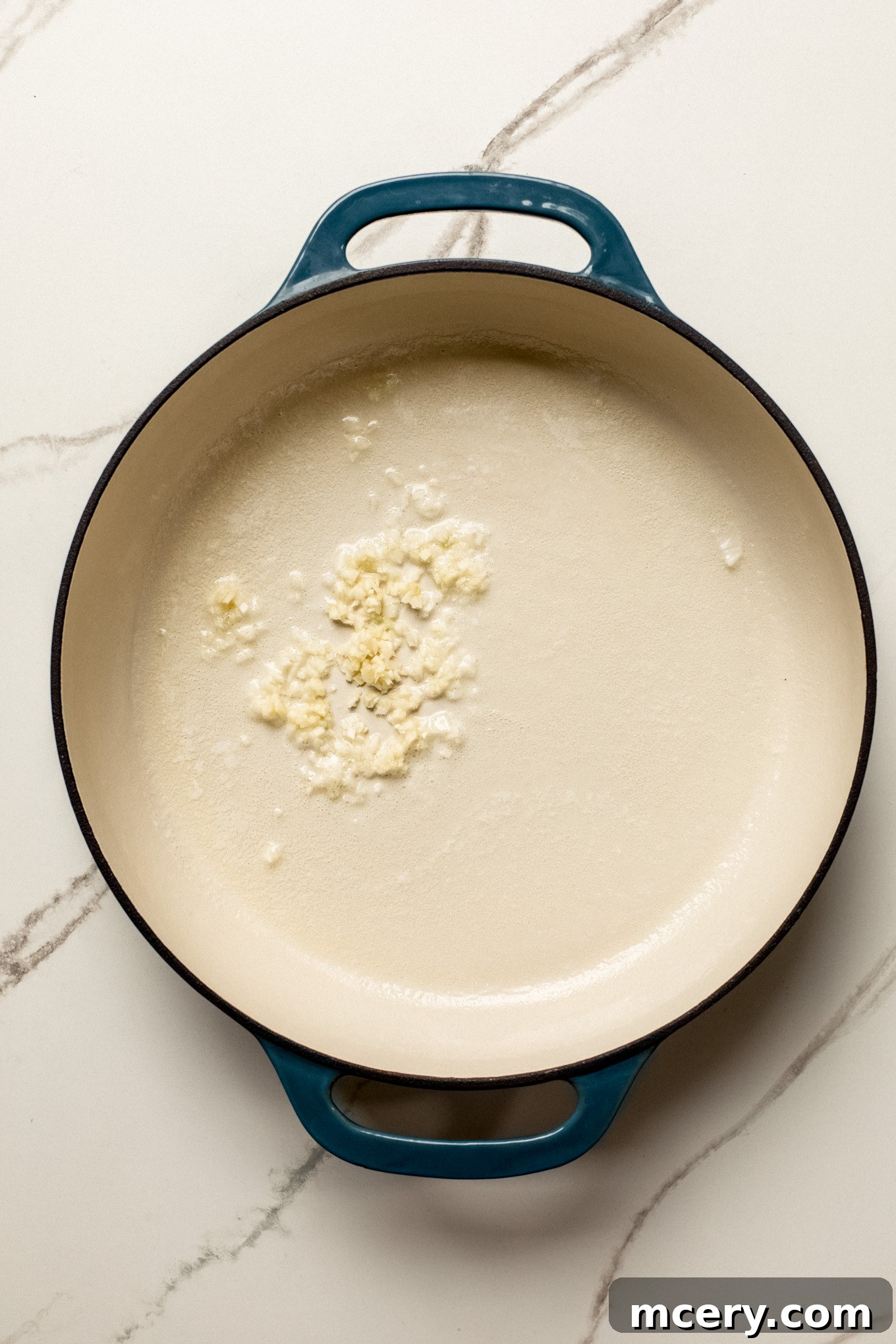 minced garlic in a skillet with butter.