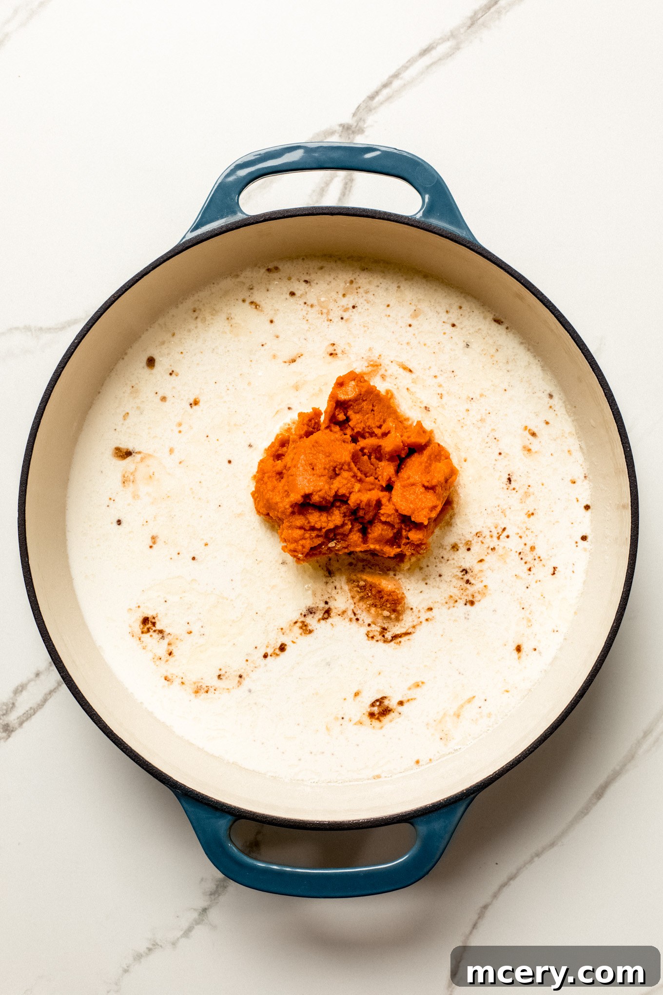 half and half and pumpkin puree in a skillet.