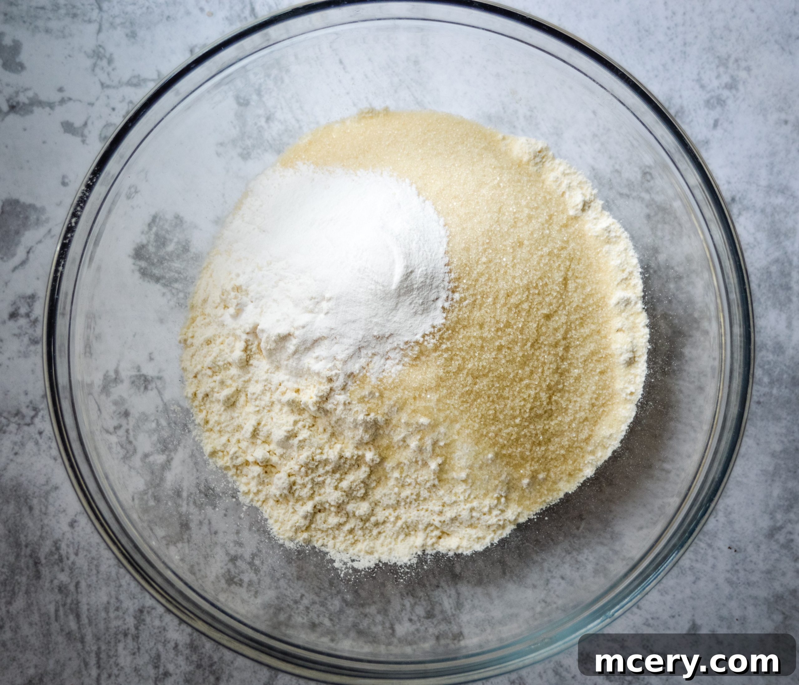 Strawberry Crumb Coffee Cake 4 A bowl filled with dry ingredients like flour, sugar, and baking powder, perfectly mixed and ready for the wet ingredients.