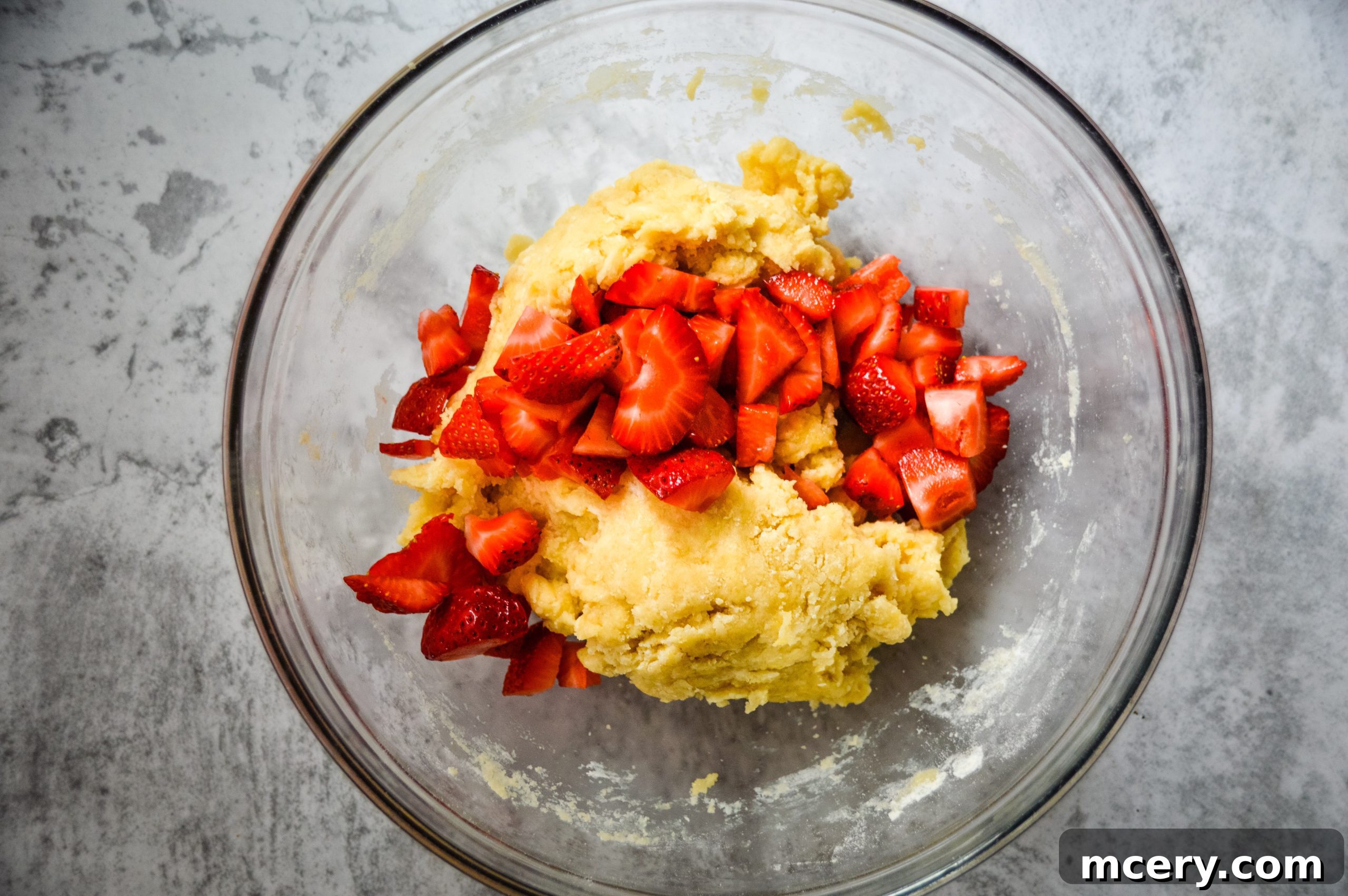 Strawberry Crumb Coffee Cake 6 Freshly diced strawberries gently folded into the thick cake batter, ensuring even distribution without crushing the fruit.