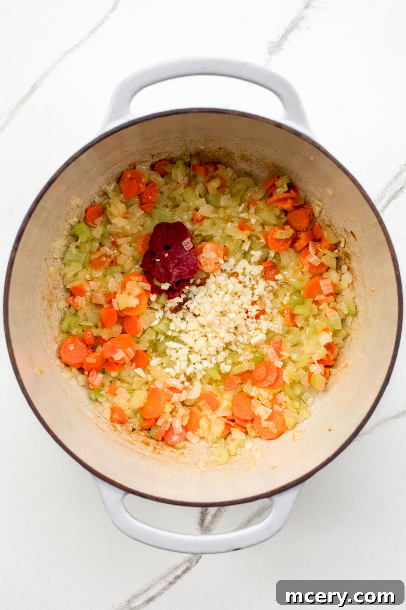 Hearty Garden Orzo Soup 4 sauteed vegetables in a soup pot.