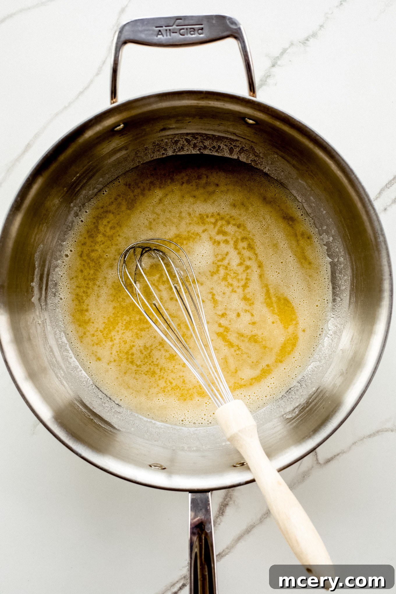 Velvet Smoked Gouda Mac 5 melted butter with flour in a pan.