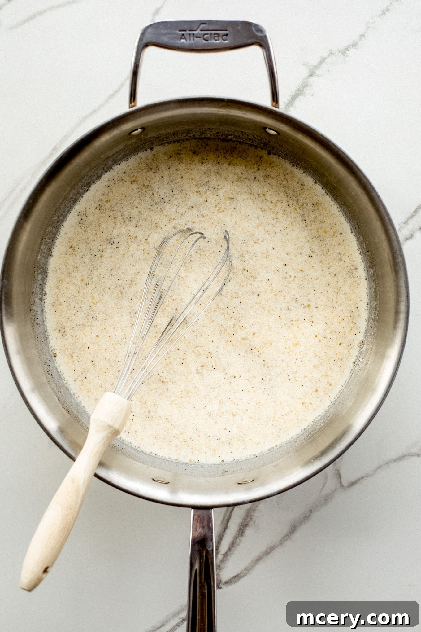 Velvet Smoked Gouda Mac 6 milk mixture in a pan.