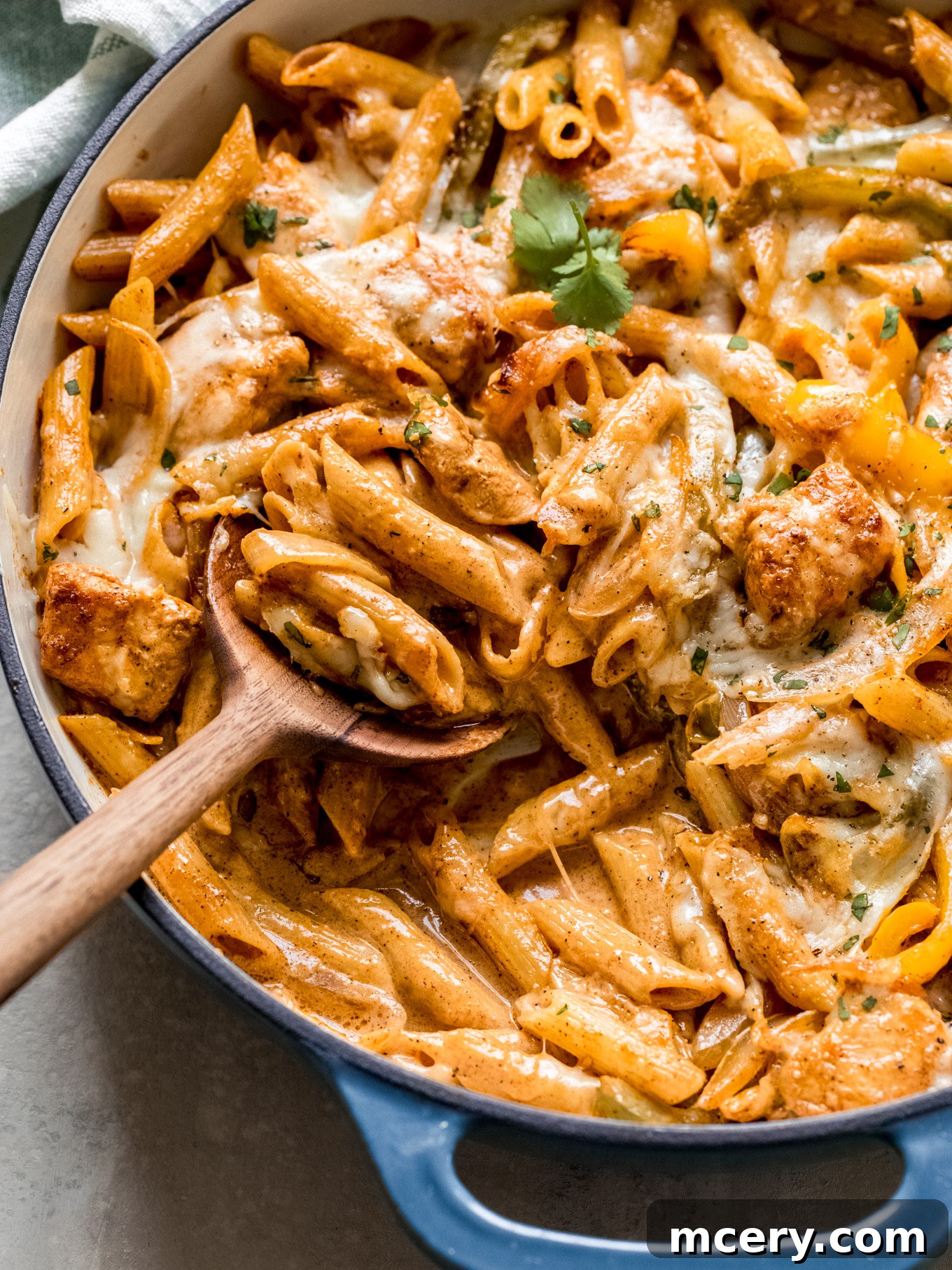Creamy Chicken Fajita Pasta 12 creamy pasta with chicken , garnished with cilantro.