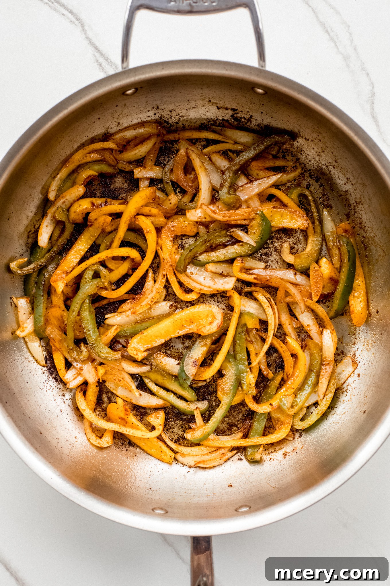 Creamy Chicken Fajita Pasta 7 cooked bell peppers in saute pan.