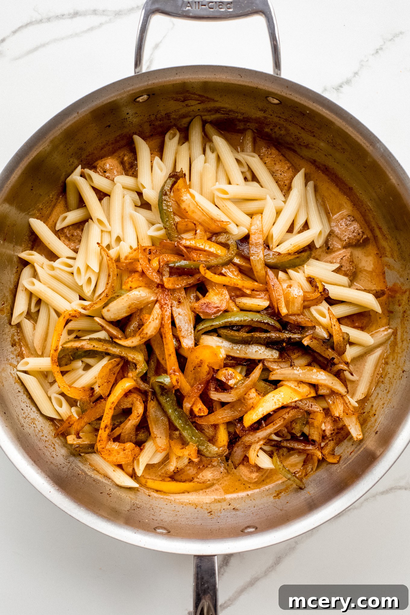 Creamy Chicken Fajita Pasta 10 cooked pasta with peppers and chicken in sauce.