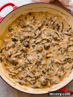 Creamy vegetarian mushroom stroganoff in a large pan.