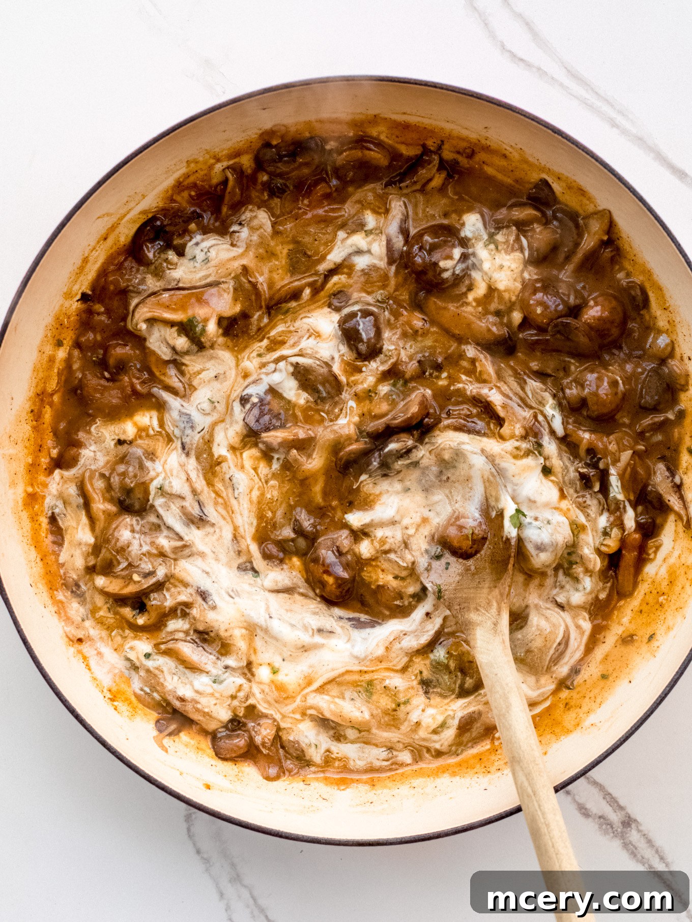Easy Weeknight Mushroom Stroganoff 9 Finished mushroom stroganoff sauce with sour cream fully blended, creating a rich, creamy texture.