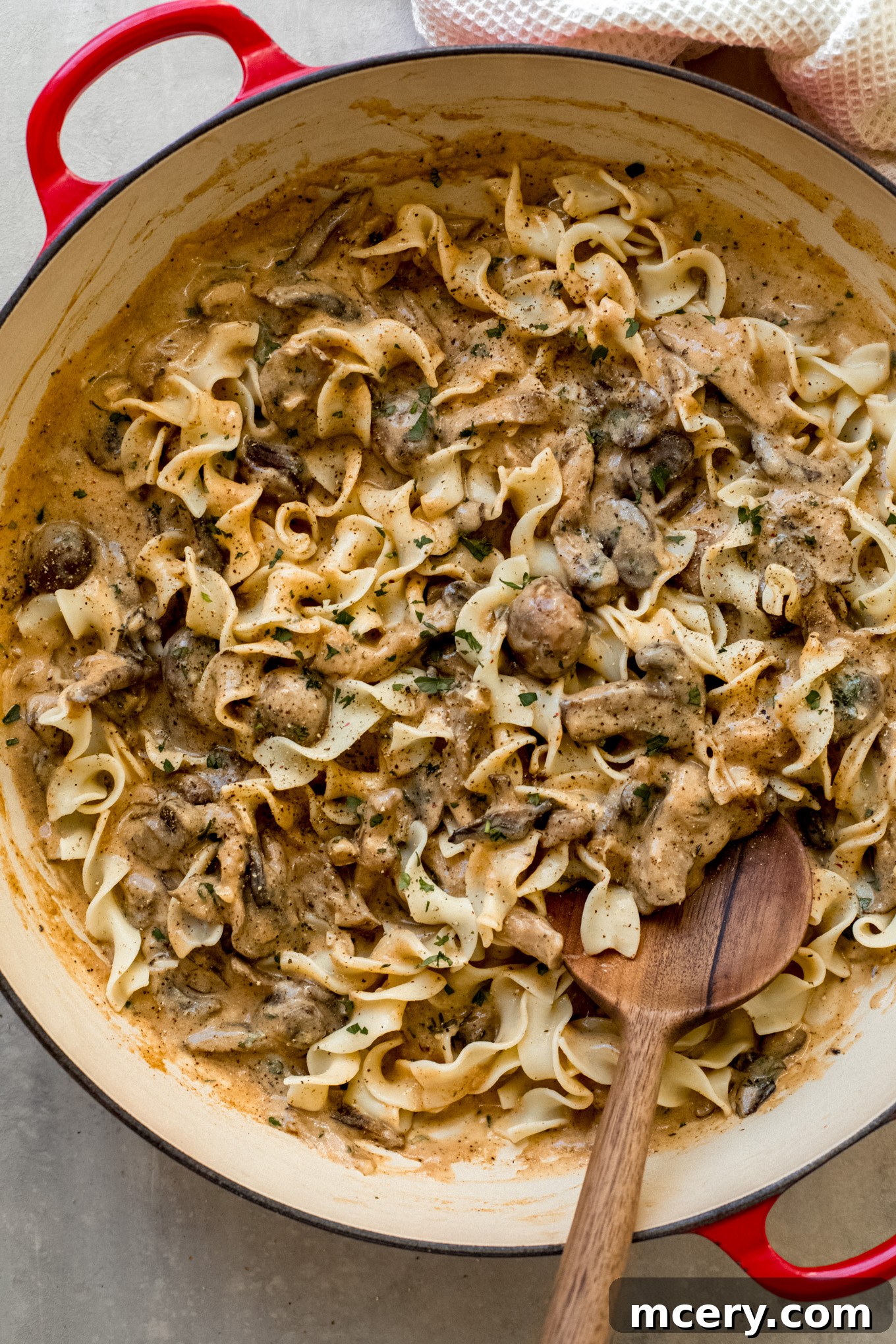 Easy Weeknight Mushroom Stroganoff 10 A large skillet filled with creamy mushroom stroganoff ready to be served over egg noodles.