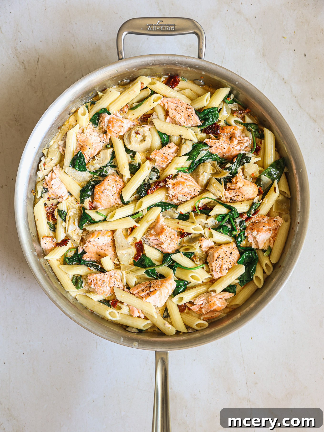 cooked pasta and flaky salmon stirred into the creamy sauce.