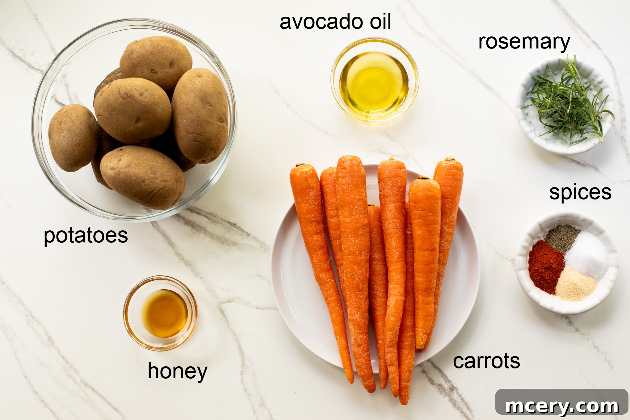 Caramelized Carrots and Crispy Potatoes 3 ingredients for oven roasted potatoes with carrots laid out on a table.