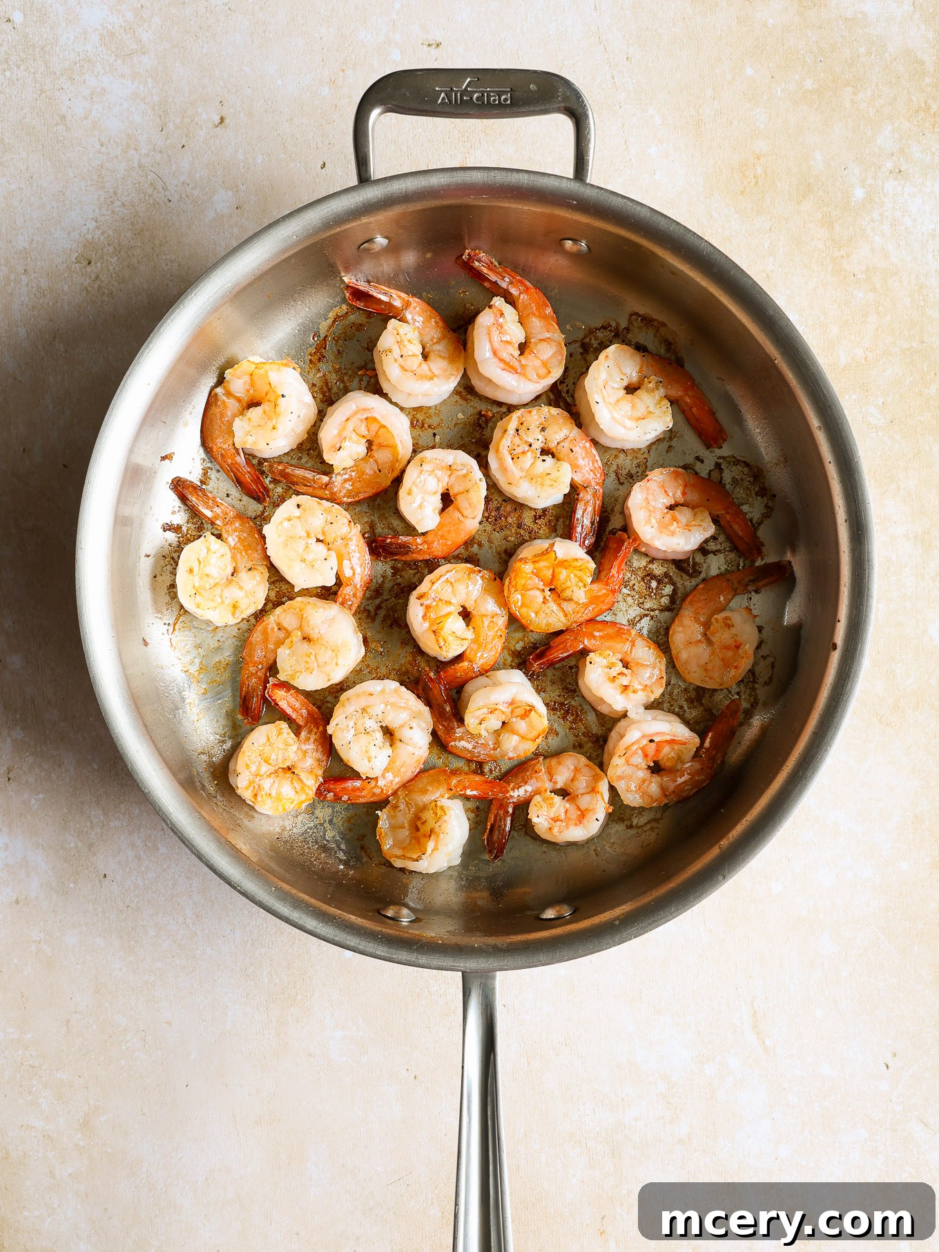 Zesty Lemon Shrimp Pasta 5 seared shrimp in a saucepan.