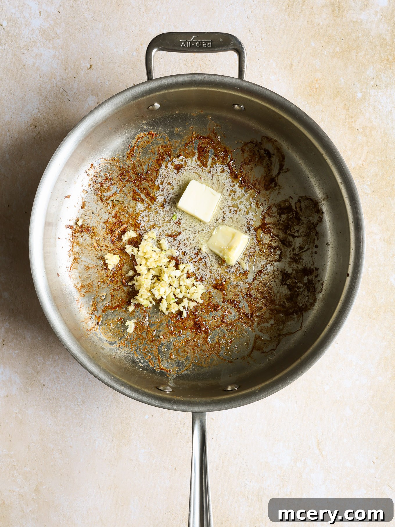 Zesty Lemon Shrimp Pasta 6 minced garlic with butter in a pan.